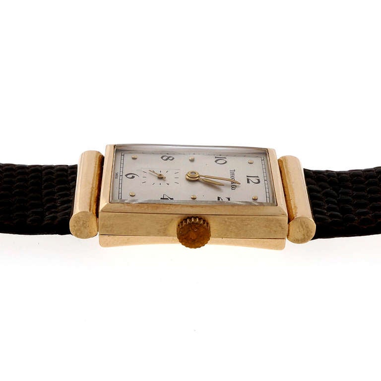 longines gold rectangular watch