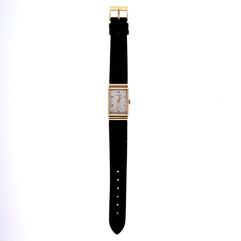 Longines `4k yellow gold rectangular wristwatch with hooded lugs, retailed by Tiffany & Co., circa 1940s.

14k yellow gold
27.3 grams
Width without crown: 20.42mm
Width with crown: 22mm
Band width at case: 18mm
Case thickness: 8.36mm
Inside