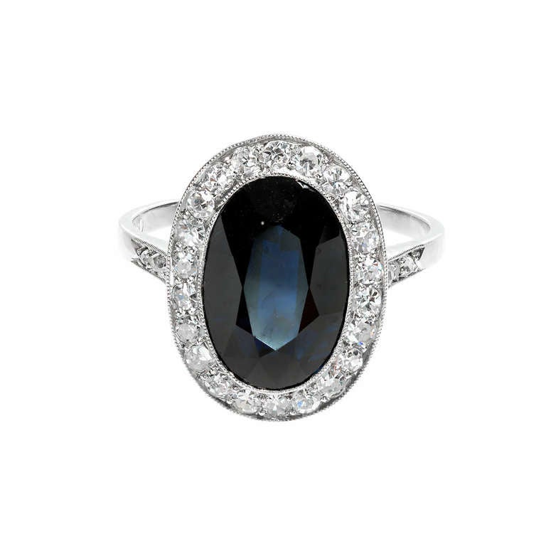 Very special 1920's Cartier Platinum ring all original with nice diamonds and a 3.50ct natural Royal dark blue Sapphire. Excellent condition, no repairs or defects. Looks great on the hand.

1 oval dark blue Sapphire, approx. total weight 3.50cts,