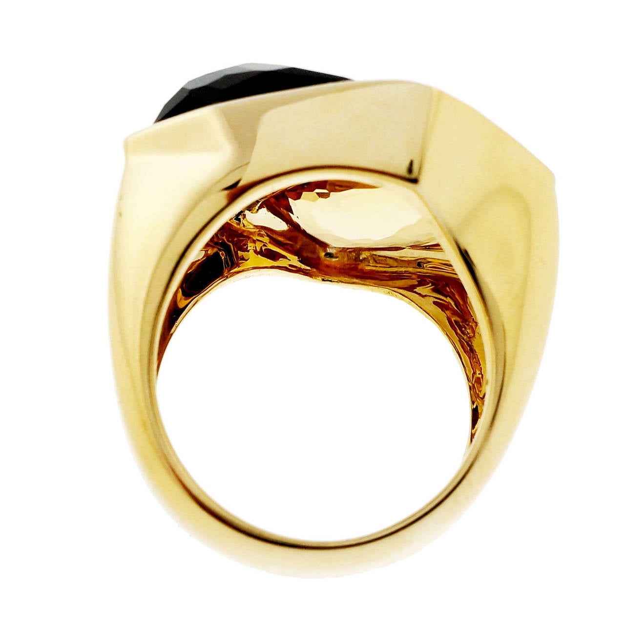Fantasy cut bright yellow Citrine and rich smoky Quartz cocktail ring. Set in a solid 18k yellow gold setting by Allia. 

1 Fantasy cut yellow Citrine, approx. total weight 7.85cts, VS, 20.82 x 11.28 x 6.05mm
1 Fantasy cut brown smoky Quartz,