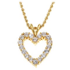 Collier à pendentif coeur ouvert en or et diamants