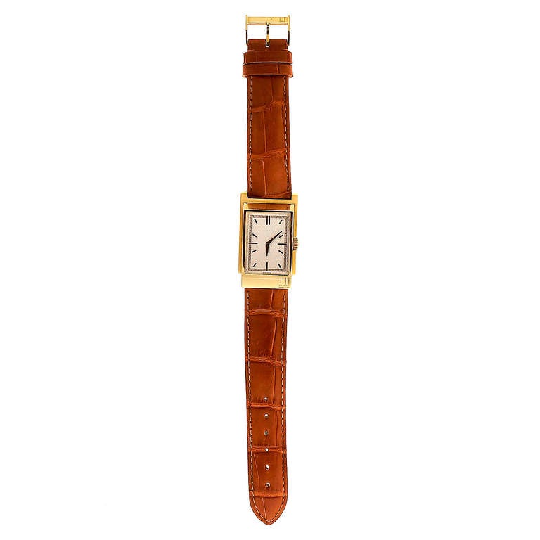 18k yellow gold Dunhill rectangular driver's wristwatch. Quartz movement. Circa 2000s.

18k yellow gold
Width without crown: 26.13mm
Width with crown: 27.08mm
Band width at case: 20mm
Case thickness: 8.05mm
Crystal: Sapphire
Outside case:
