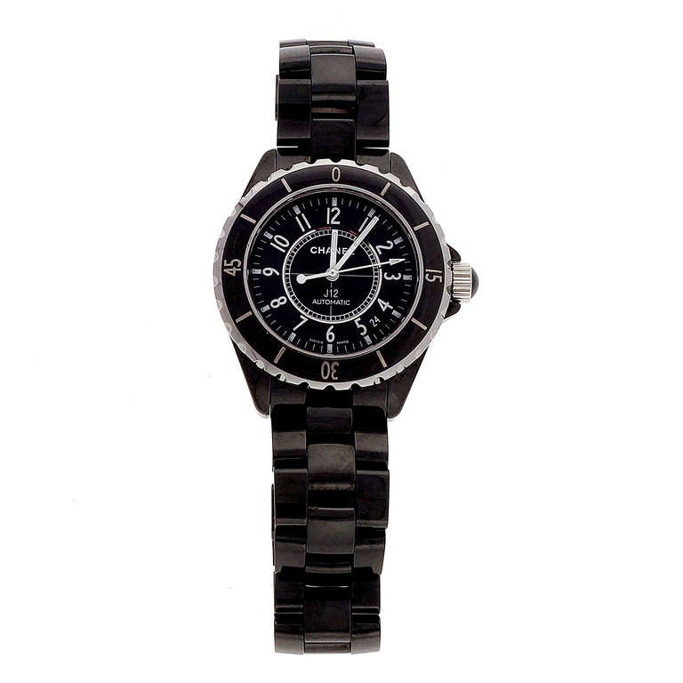 Chanel black ceramic J12 automatic wristwatch with black ceramic band.

Length: 7.5 inches
Width without crown: 38mm 
Width with crown: 43.49mm
Band width at case: 19mm
Case thickness: 11.53mm
Crystal: Sapphire Dial
Outside case: Chanel