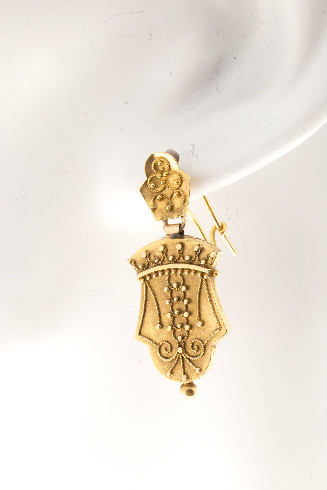 Mid Victorian Original handmade 14k yellow gold Dangle Earrings. circa 1860's

14k Yellow Gold
4.0 grams
Top to bottom: 1.42 inch or 36.26mm
Width: 15.36mm or .60 inch
Depth: 2.4mm