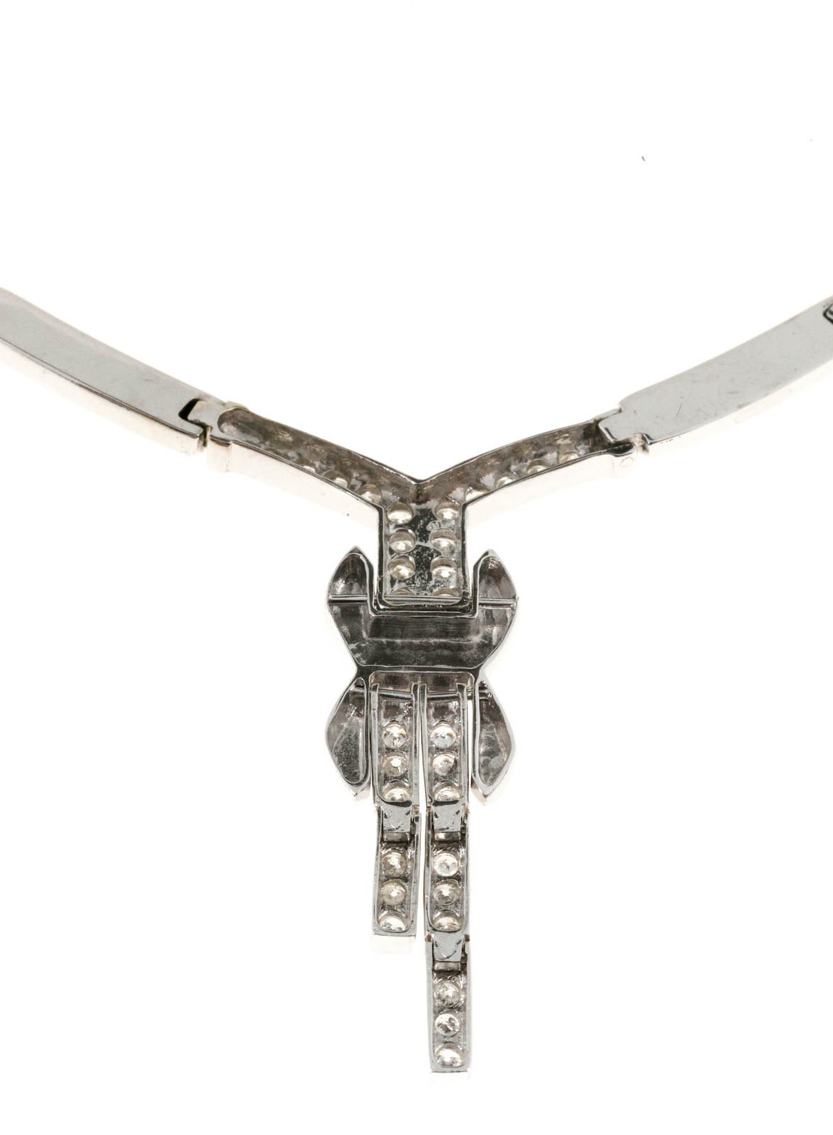 Fabulous 1950's Hinged link 14k white gold necklace with a hinged diamond center. Hidden catch and side lock safety.

31 full cut diamonds, approx. total weight .62cts, G, SI1
14k White Gold
Stamped: 14k
16.5 grams
Length: 18 inches
Center
