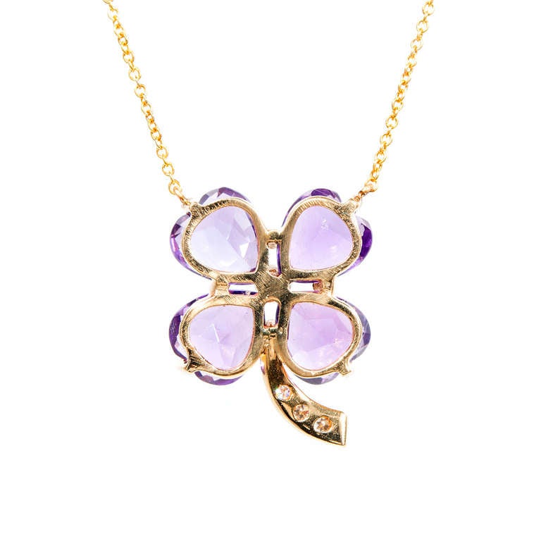 1950 to 1960 handmade 4 leaf clover Amethyst pendant. Chain attaches to the top of the Amethyst.. Excellent condition, no repairs or defects. Looks great on the neck. White gold under diamonds. 14k Yellow gold

4 heart shaped Amethyst, approx.
