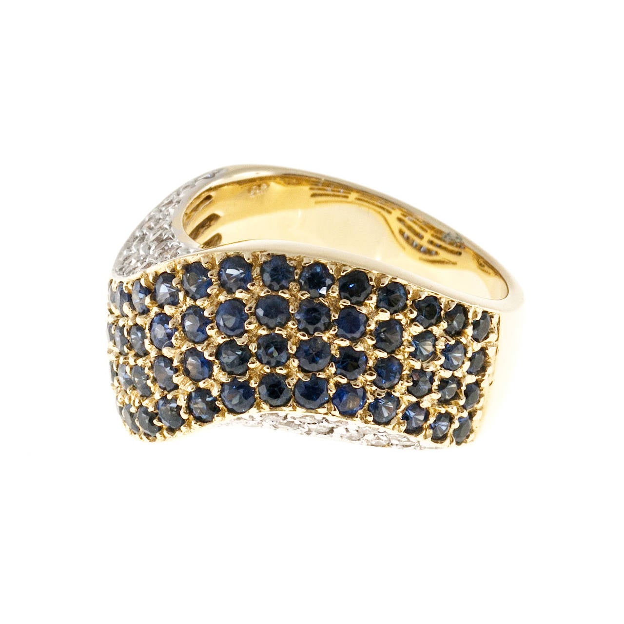 sapphire and diamond swirl band ring. Tapered slightly domed swirl ring with a little bit of twist. Solid 14k yellow gold. The top is pave set with 5 rows of genuine bright sapphires. Each side is pave set with 3 rows of well-cut bright white full