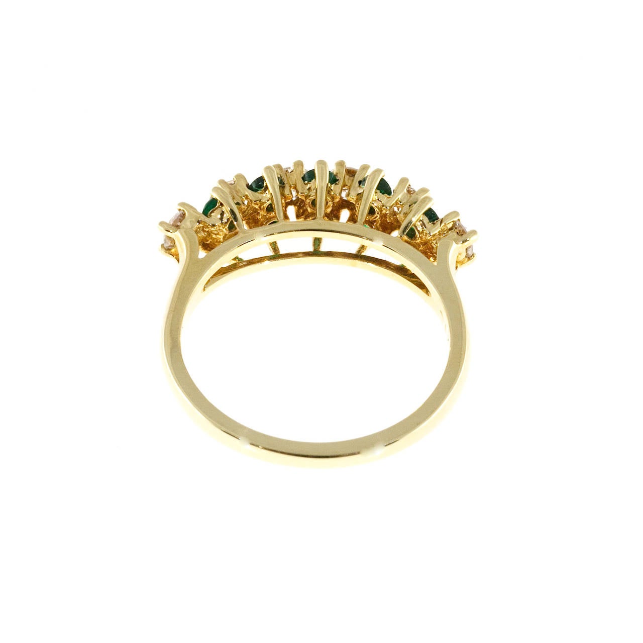 Designer KN handmade 18k yellow gold ring with Colombian gem Emeralds and fine white full cut diamonds.

10 gem Colombian Emeralds, approx. total weight .40cts
6 full cut F, VS diamonds, approx. total weight .50cts
18k Yellow Gold
Stamped: 750