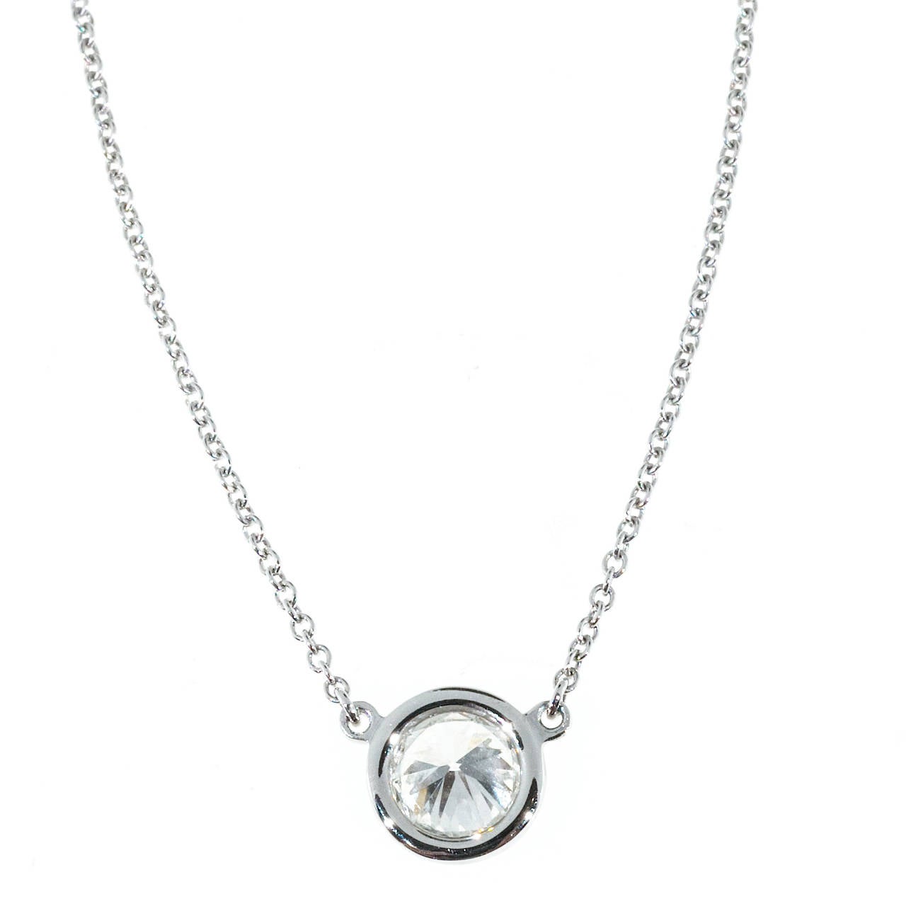 Tiffany & Co. Elsa Peretti Diamonds by the Yard pendant fully stamped and serial numbered.

1 round diamond, approx. total weight .62cts, E-F, VVS2
Platinum
Stamped: PT 950
Tested: Platinum
Hallmark: Tiffany & Co Peretti
2.6 grams
Chain