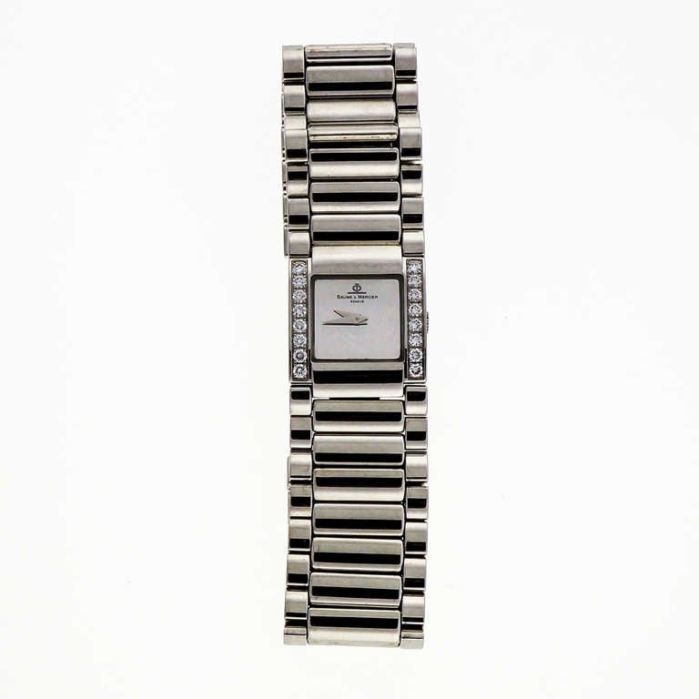 Baume & Mercier lady's stainless steel and diamond Catwalk wristwatch with quartz movement, circa 1990s.

16 diamonds approx. .65cts, F, VS

Bracelet: 6.5 inches long
Top to bottom: 22mm
Width without crown: 21mm
Width with crown: