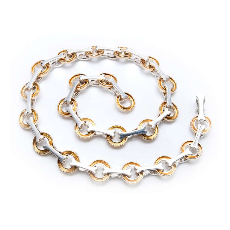 Tiffany & Co  Paloma Picasso 18k solid gold and silver XO necklace.

18k Yellow gold and silver 
Circles: 13mm or .51 inch 
Depth: 2.81mm 

