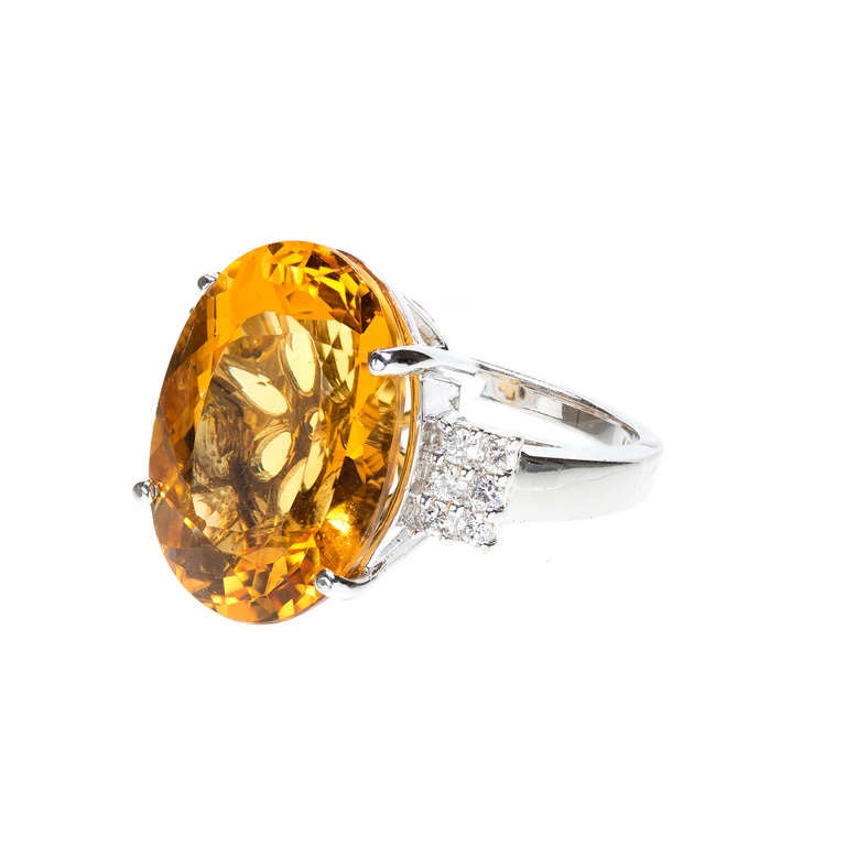 Yellow Beryl 18.00cts in a 14k white gold Diamond ring signed LAB. Circa 1970-1980. 
14k White gold

1 genuine rich golden yellow Beryl, approx. total weight 18.00cts, VS, 19.3 x 14mm

12 full cut diamonds, approx. total weight .26cts, F,
