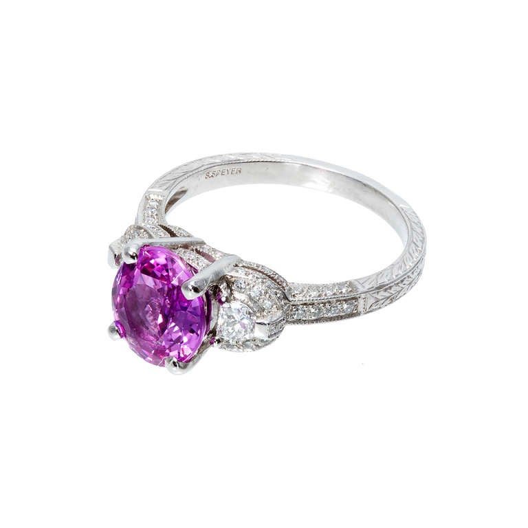 Peter Suchy Gem quality hot pink sapphire and diamond engagement ring. Handmade platinum setting with hand engraving and micro pave diamonds designed just for this stone. Made in the Peter Suchy workshop.

80 rounded diamonds approximate weight .40