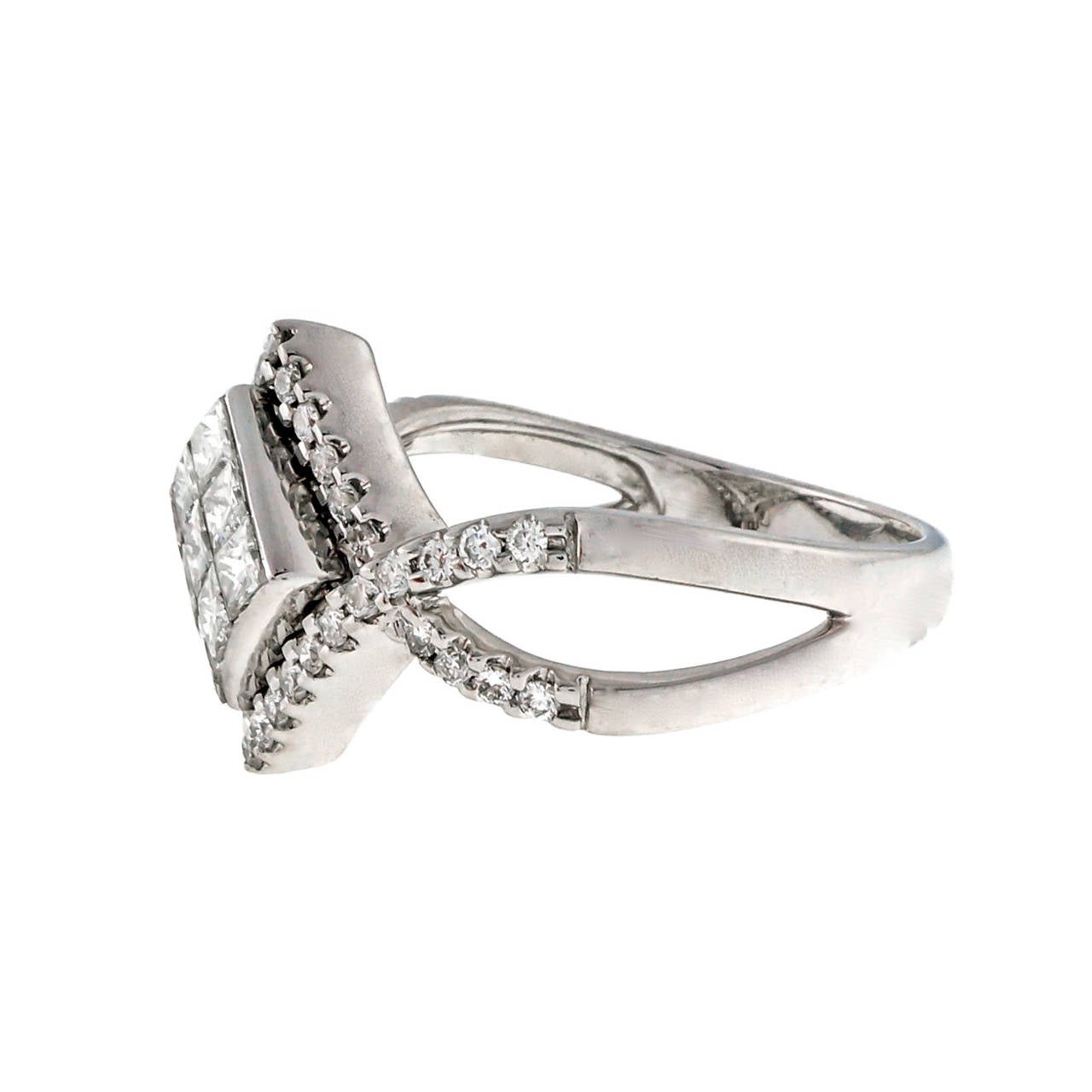 Beautiful Princess cut invisible set and round 14k white gold ring.

9 Princess cut diamonds, approx. total weight .76cts, G – H, VS2 – SI1, 2mm
40 round diamonds, approx. total weight .24cts, G – H, VS2 – SI1
Size 7 and sizeable
14k white