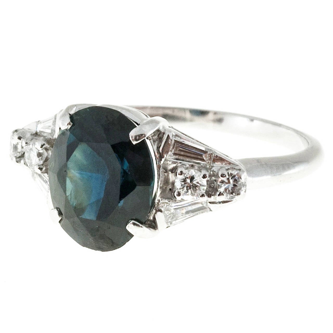 Natural no heat dark blue Sapphire and diamond handmade engagement ring. The setting is the old mixture for Platinum, 90% Platinum and 10% iridium.

1 oval dark blue Sapphire, approx. total weight 3.30ct, SI, 10 x 7.95 x 5.15mm, natural color, no