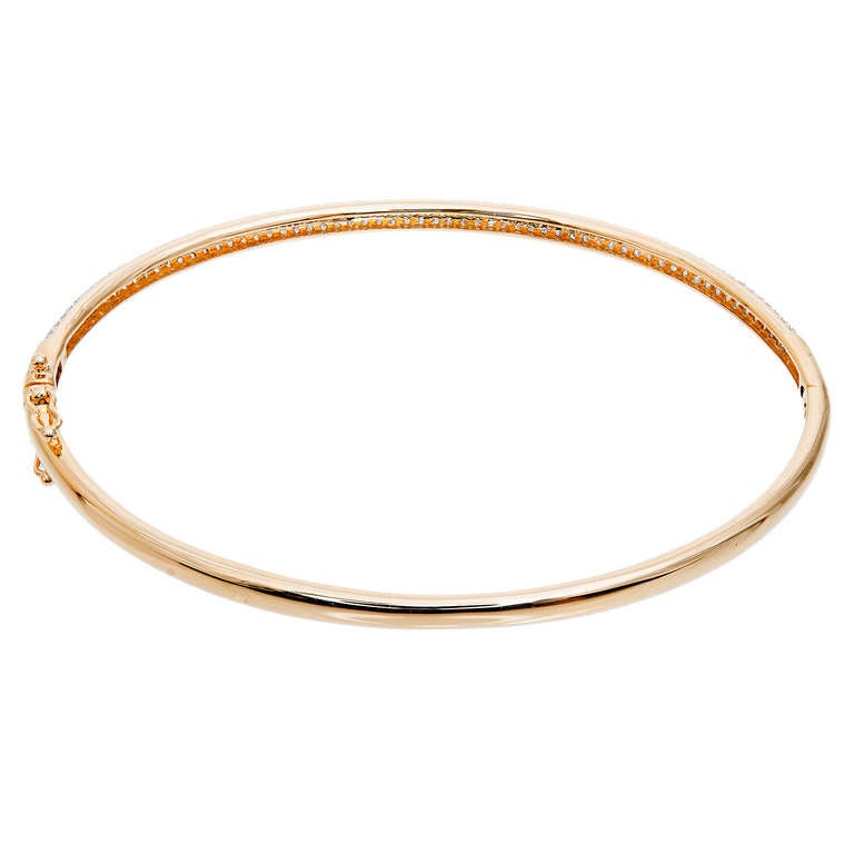 Micro pave set full cut diamond 14k yellow gold bangle bracelet. 

14k Yellow gold 
183 round full cut diamonds, approx. total weight 1.11cts, G-H, VS2-SI1 
Width: 3mm 
6.8 grams 
Tested and stamped: 14k 
Inside dimensions: 2.36 x 1.98mm