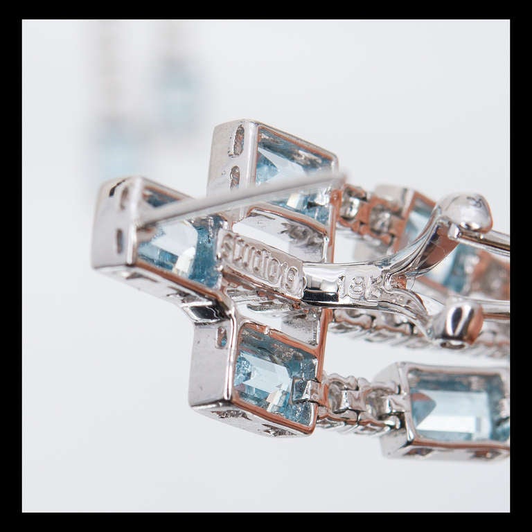 Studio 19 untreated Aqua and diamond dangle drop earrings with top bright blue aquas and diamonds.  Clip post style tops. 

18k White gold 
22 Emerald cut natural Aqua, approx. total weight 6.37cts, 6 x 3.5mm 
78 round full cut diamonds, approx.