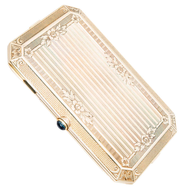 Art Deco ladies compact circa 1910-1919 from Carter, Gough and Co. Notepad and pencil compartment behind the mirror. Extra fine engraving and detail work.

1 sapphire approx total weight.  .50cts   5x3.5
Top to Bottom: 54.26 mm or 2.13