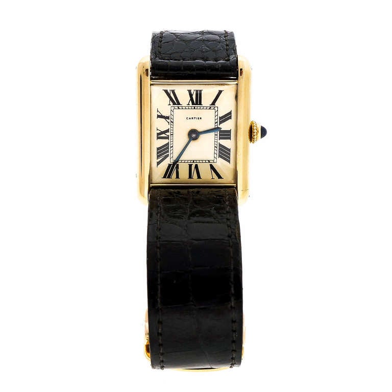Rare 1963 Cartier 18k yellow gold Tank wristwatch, circa 1963, 18 jewels. With 18k yellow gold deployant buckle. Modified Patek Philippe movement. Custom made band. 

18k yellow gold
Top to bottom: 31mm
Width without crown: 22.85mm
Width with