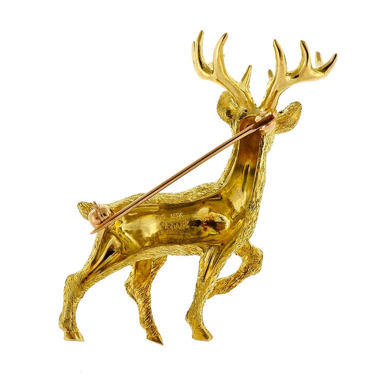 2 dimensional Tiffany & Co textured deer stag pin with nice Ruby eyes. Excellent color. Looks great on the blouse.
Unknown hallmark.18k Yellow gold

2 genuine bright red Rubies, approx. total weight .03cts, VS
15.8 grams
Tested and stamped: