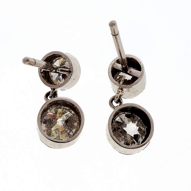 1910-1930 old European cut diamond handmade dangle earrings with bright sparkly beaded edge simple drops. All Platinum. Looks great on the ear. 1.65ct total. 

Platinum
1 old European brilliant cut diamond, approx. total weight .60cts,  F-G,