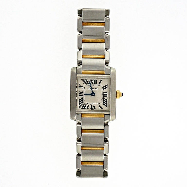 Cartier lady's small size stainless steel and 18k yellow gold Tank Francaise wristwatch, quartz movement, Ref. 2300, circa 2000.

Stainless steel and 18k yellow gold 
Bracelet length: 6 1/8 inches 
Top to bottom: 24.18mm 
Width without crown: