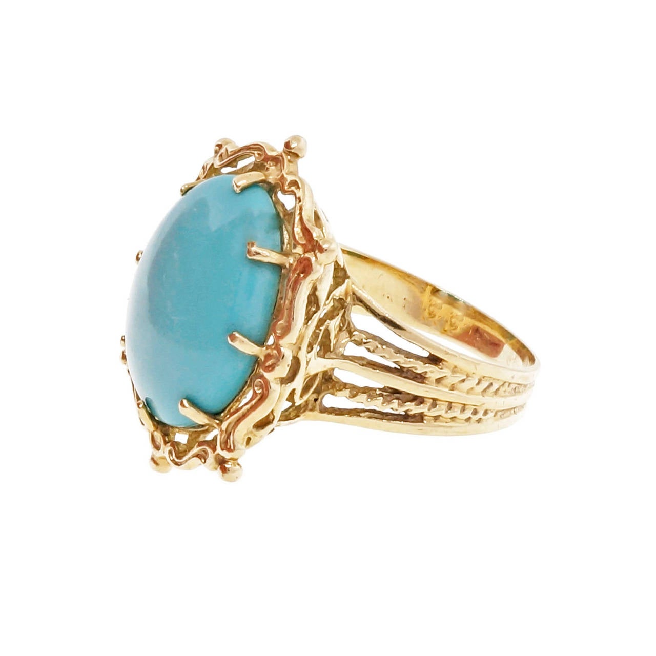 Large oval Turquoise 14k yellow gold open work cocktail ring. Circa 1970s with natural untreated bright blue Turquoise. 

1 oval cabochon Robins Egg blue natural untreated Turquoise, 15.79 x 11.57mm
Size 7.75 and sizable
14k yellow gold
5.6