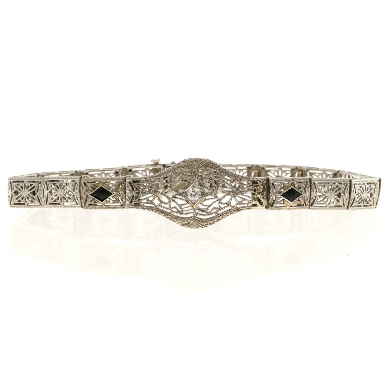 Diamond Calibre Sapphire White Gold Filigree Bracelet For Sale at