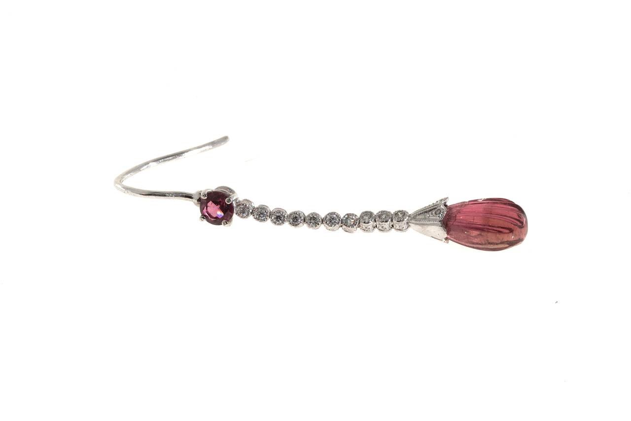 Handmade Platinum hand engraved hinged dangle earrings with pink Tourmaline round top and carved tear drop bottom with beautiful full cut diamonds. Old fashion plain wire tops.

4 fancy pink Tourmaline approx. total weight 6.28cts
24 round