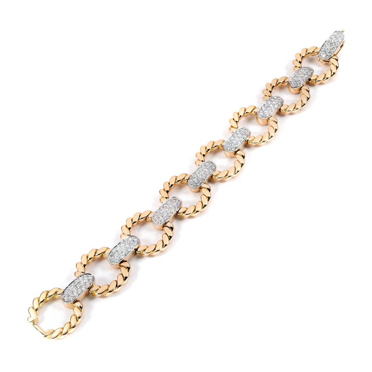 Spectacular Cartier 1950 handmade bracelet with hand twisted wire 18k yellow gold circles separated by oval gold links with Platinum tops pave set with 4.00cts of fine full cut diamonds. Made in France. Secure catch with figure 8 safety.

152