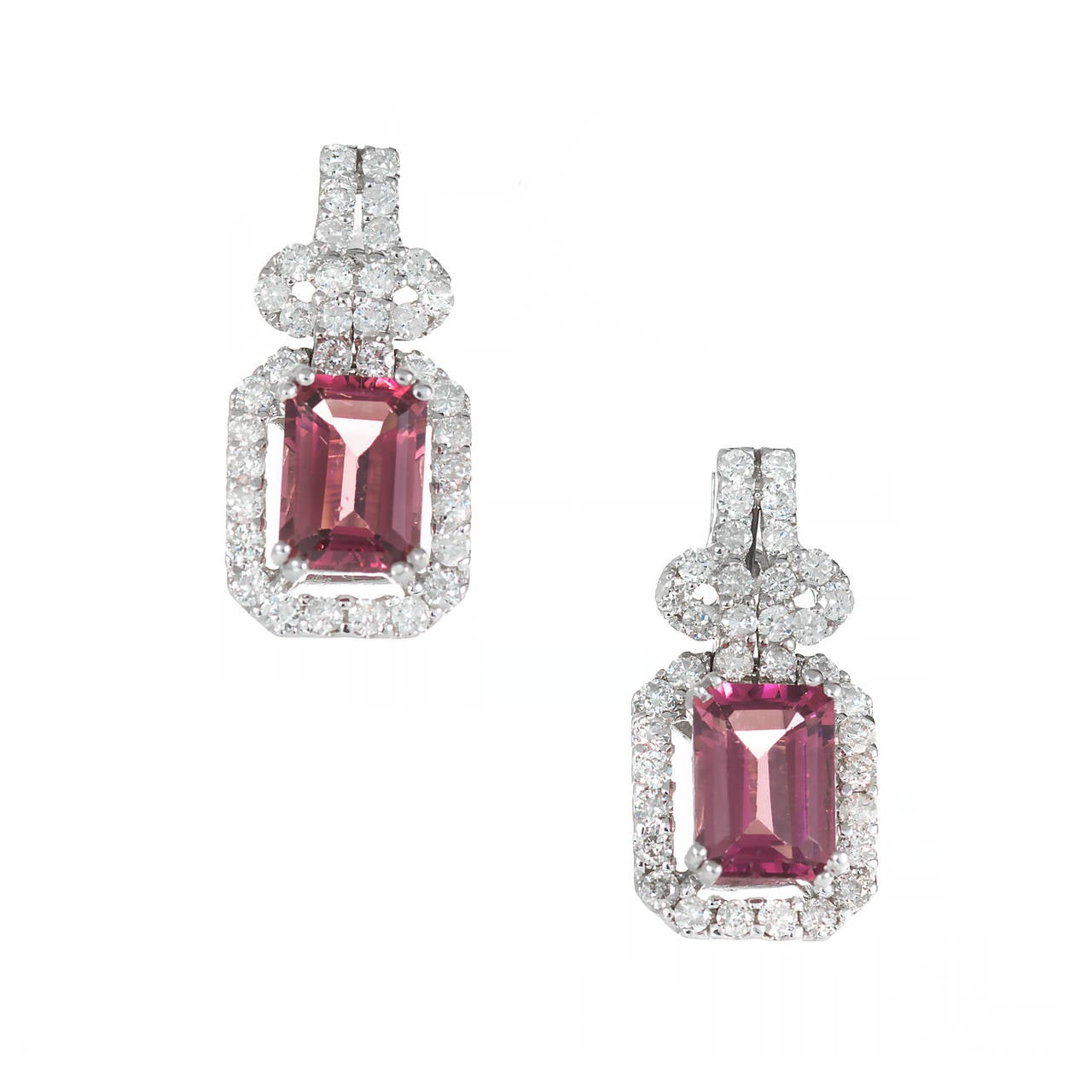 Very nice simple full cut diamond dangle earrings in 18k white gold with Emerald cut pink Tourmaline.

2 Emerald cut pink Tourmaline, approx. total weight 1.90cts, VS
72 round full cut diamonds, approx. total weight .75cts, H, SI
18k white