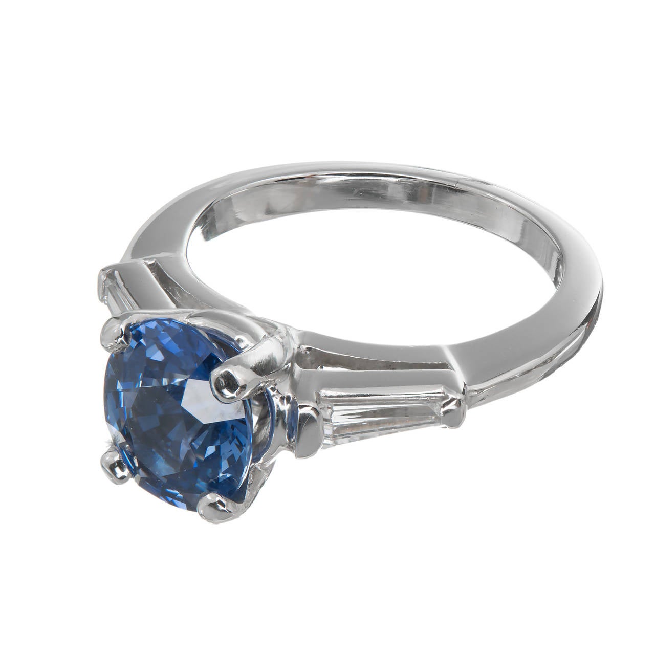 Solid Platinum handmade classic 1950 engagement ring with a bright gem blue all natural no heat 2.03ct Sapphires set with 2 bright white tapered baguette diamonds. 1950 vintage at its best. Center stone removed for certification.

1 oval gem