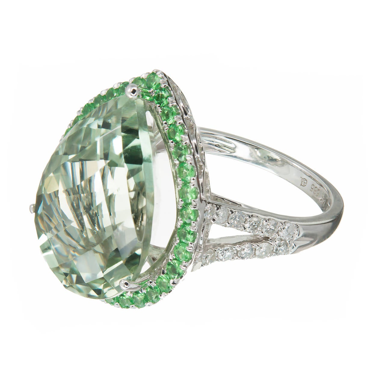 Faceted top pear shape Prasiolite green Quartz and diamond cocktail ring. 14k white gold setting with green quartz center stone and Tsavorite Garnet halo and round diamond shoulders.

1 pear shape green Quartz, approx. total weight 11.47cts, VS
34