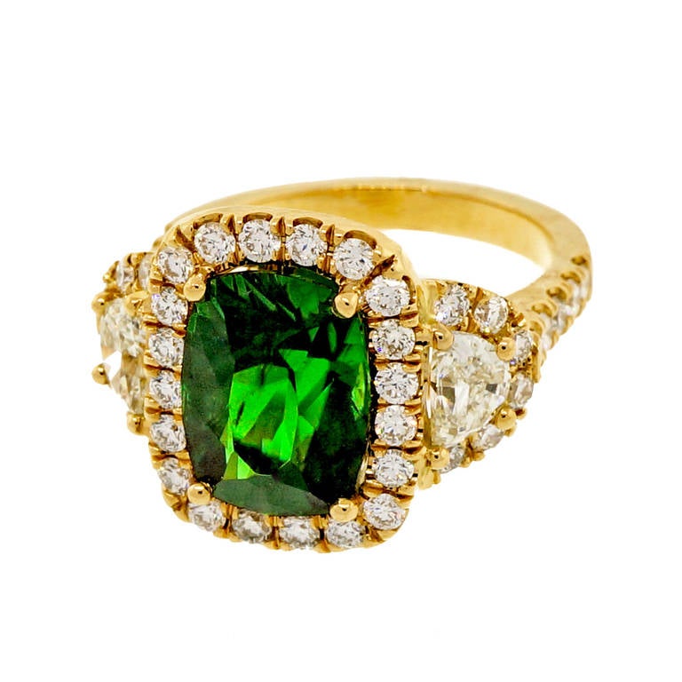 Very special Circa 1900 antique cushion cut rare natural gem rich green chrome Tourmaline. Set in a new ring designed by the Peter Suchy Workshop to show off the natural beauty of the stone.

1 antique old cushion cut chrome green Tourmaline,