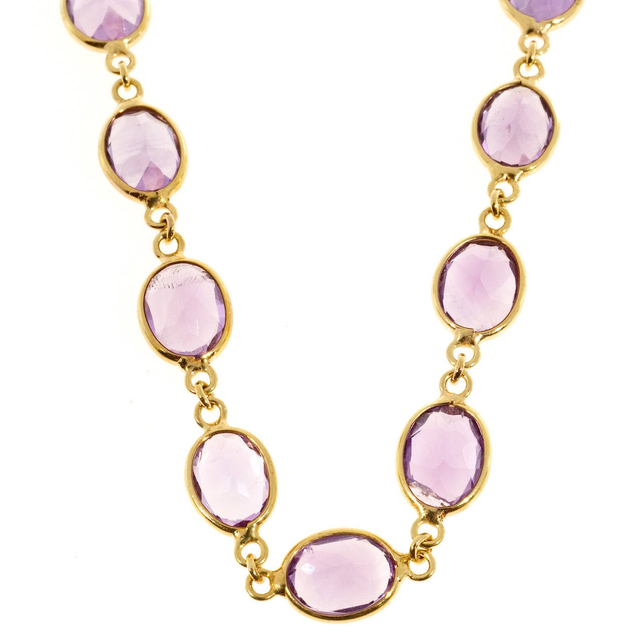 Amethyst by the Yard hinged oval link   necklace with 35.00cts of bright purple Amethyst.

28 8 x 6mm fine oval genuine Amethyst, approx. total weight 35.00cts
14k Yellow Gold
Stamped: 14k 585 Italy
12.4 grams
Bezel width: 7.1mm
Length: 16