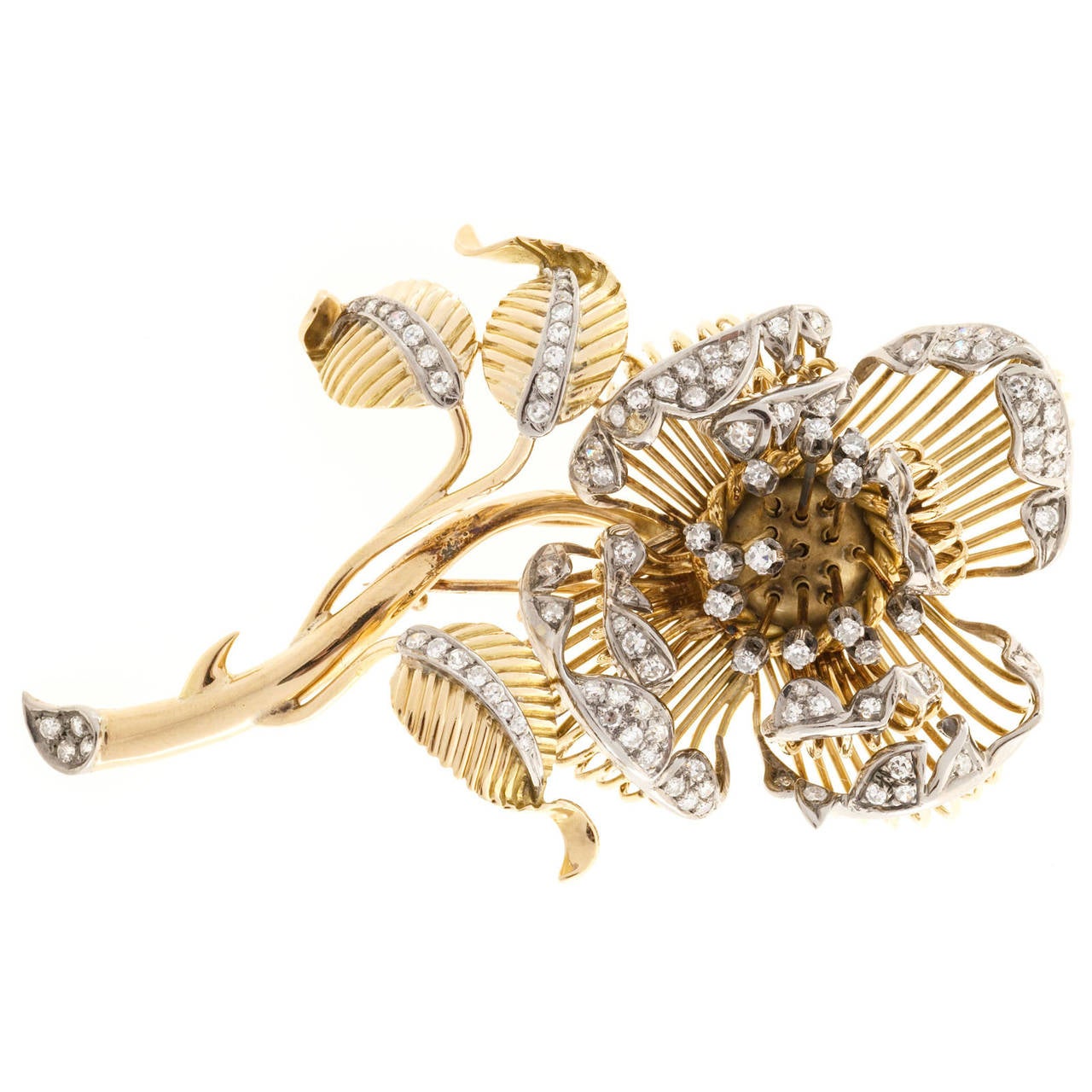 En Tremblant Large handmade solid 18k yellow and white gold diamond brooch. The leaves and flower tips are all white gold and bead set with over 100 bright sparkly diamonds. The four outer most floral pedal are stationary. The four inner flower