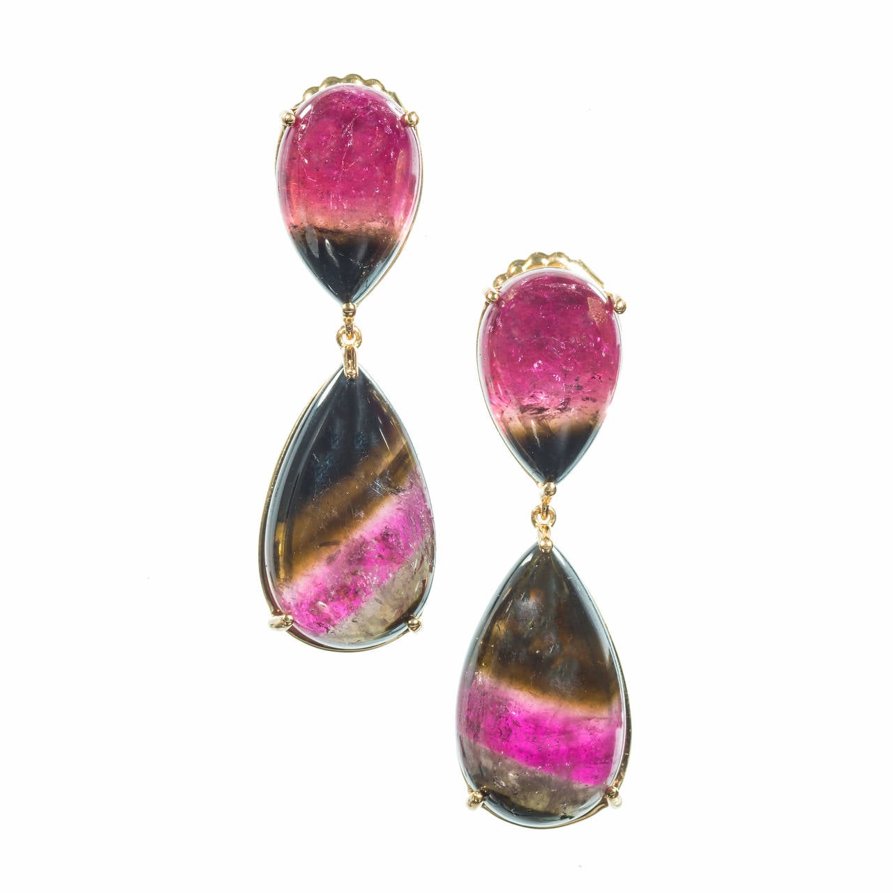 Rare matched set of pink and green natural untreated Tourmaline 47.18cts total. Bright and clear in simple handmade frames. Made in the Peter Suchy Workshop.

2 pear cabochon bi color pink and green Tourmaline, approx. total weight 18.34cts, MI,