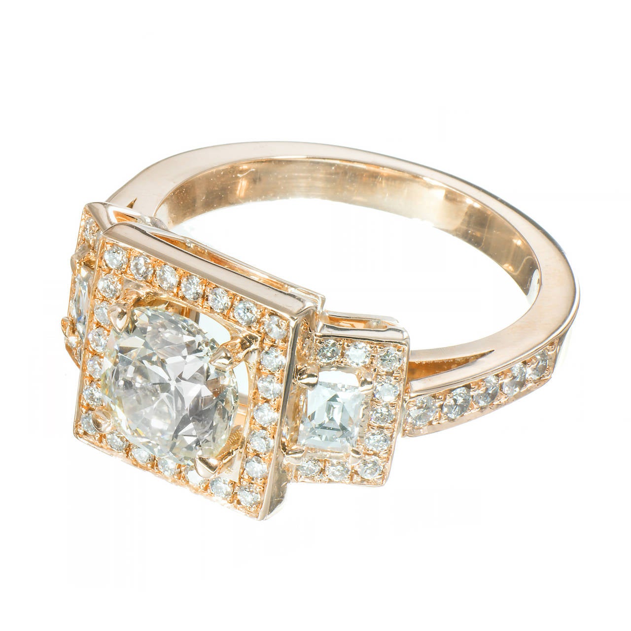 Antique cushion brilliant cut diamond, matched with 2 old French Style Emerald cut side diamonds. triple halo diamond engagement ring. crafted by Peter Suchy. 

1 antique cushion cut diamond, approx. total weight 1.26cts, S – T, VVS2, GIA