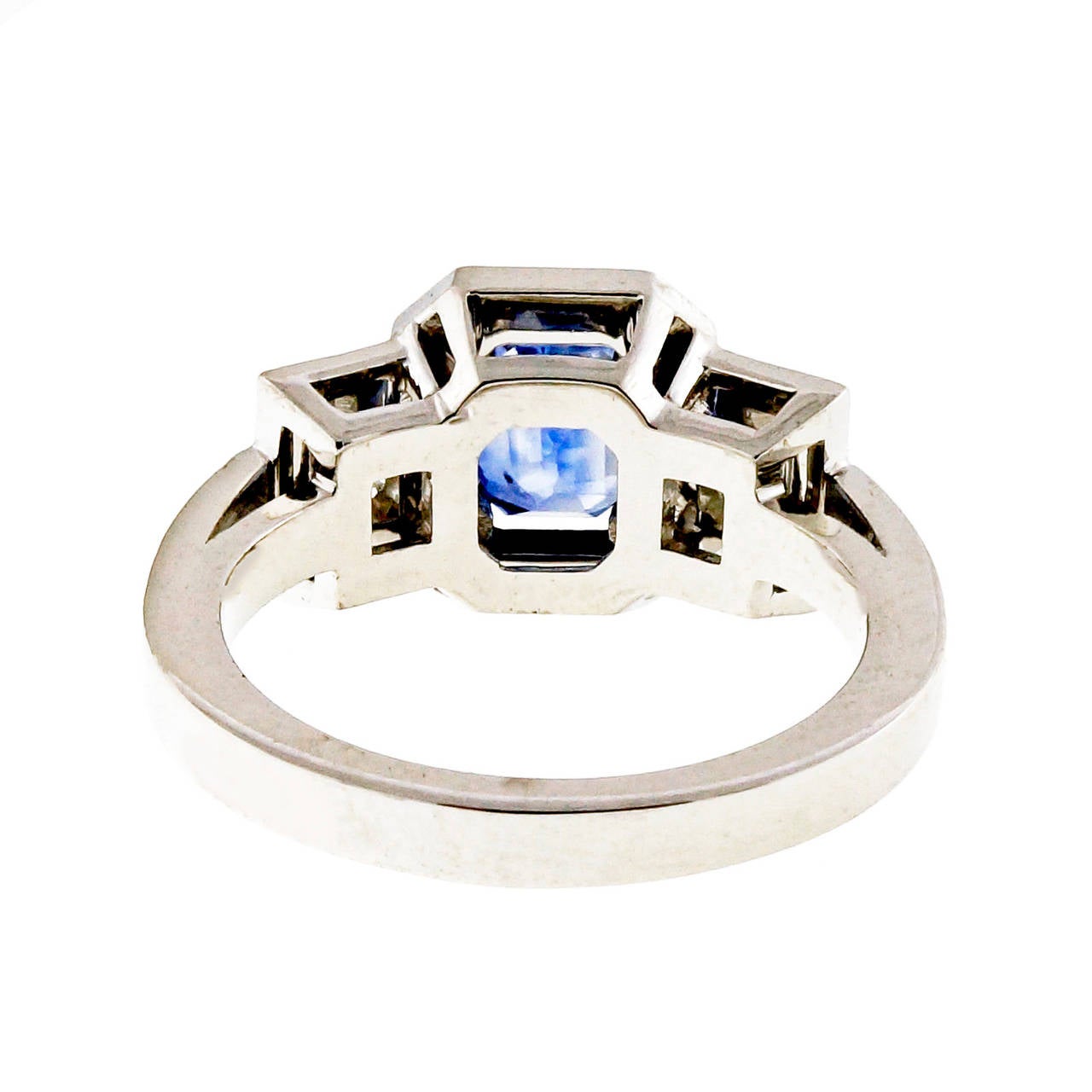Bright medium blue Emerald cut natural color simple heat only Sapphire from an estate in a classic triple halo made for the stones.

1 Emerald cut Sapphire, approx. total weight 1.53cts, heat, natural color simple heat only, AGL certificate