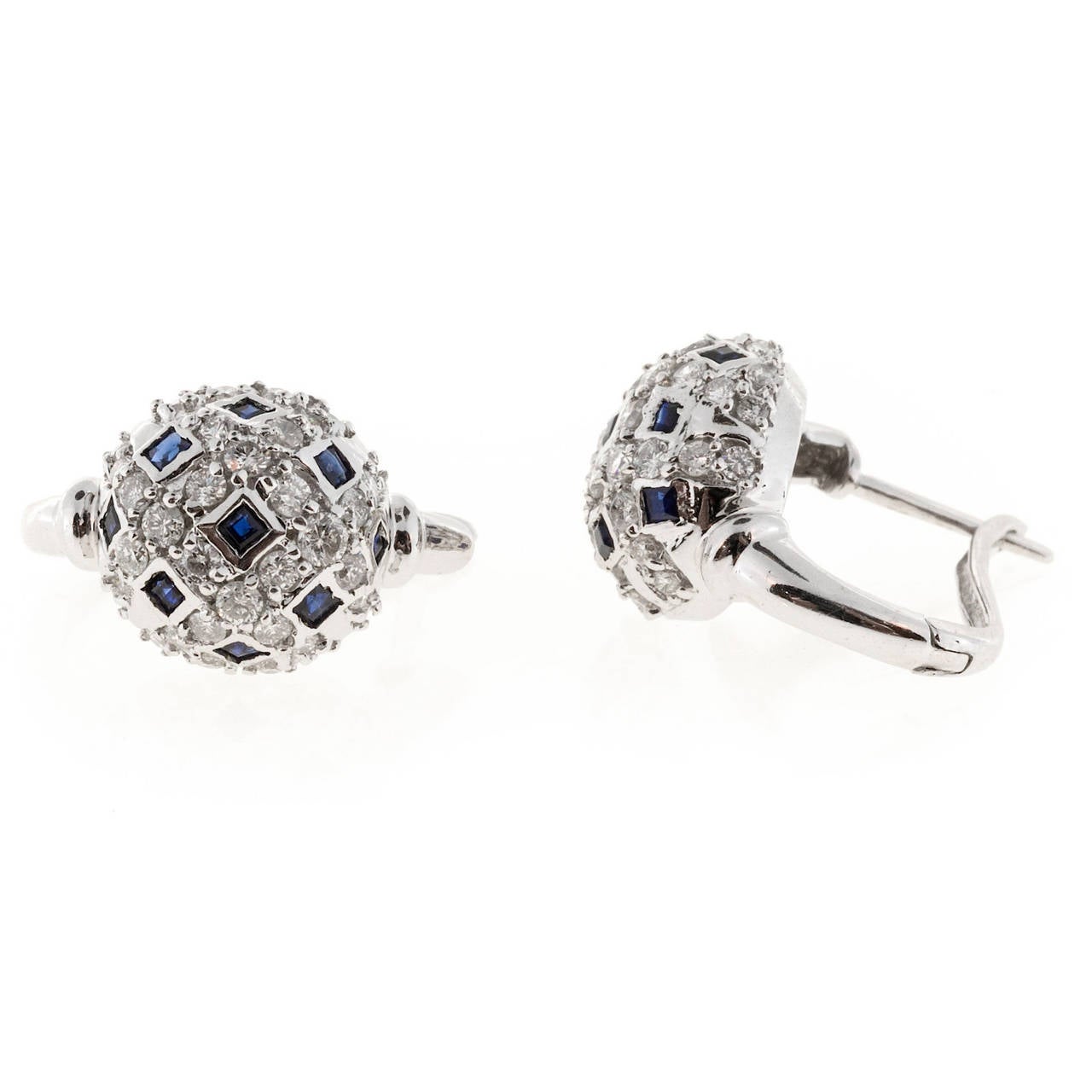 Domed 1970 round diamond square Sapphire 14k white gold earrings.

36 round diamonds, approx. total weight 1.08cts, G, VS
18 square Sapphires, approx. total weight .90cts
14k white gold
Tested: 14k
Stamped: 585
Hallmark: S with a circle