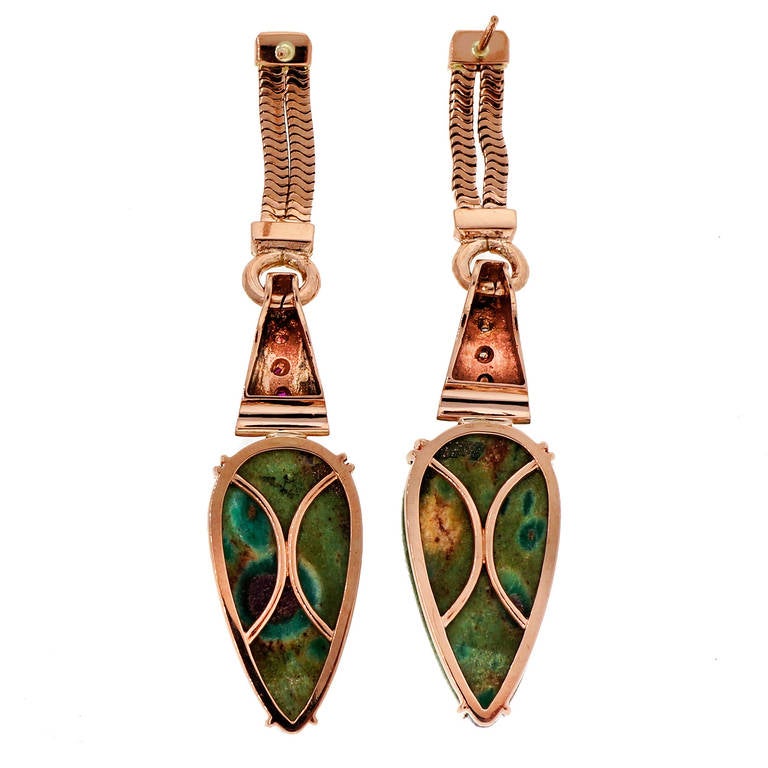 Peter Suchy 14k rose gold 1930's ruby and diamond dangle earrings. Dangle design with post tops, snake chain dangle and wonderful Zoisite pears and round Rubies. 

2 light green to red opaque pear Zoisite, approx. total weight 30.00cts, rare with