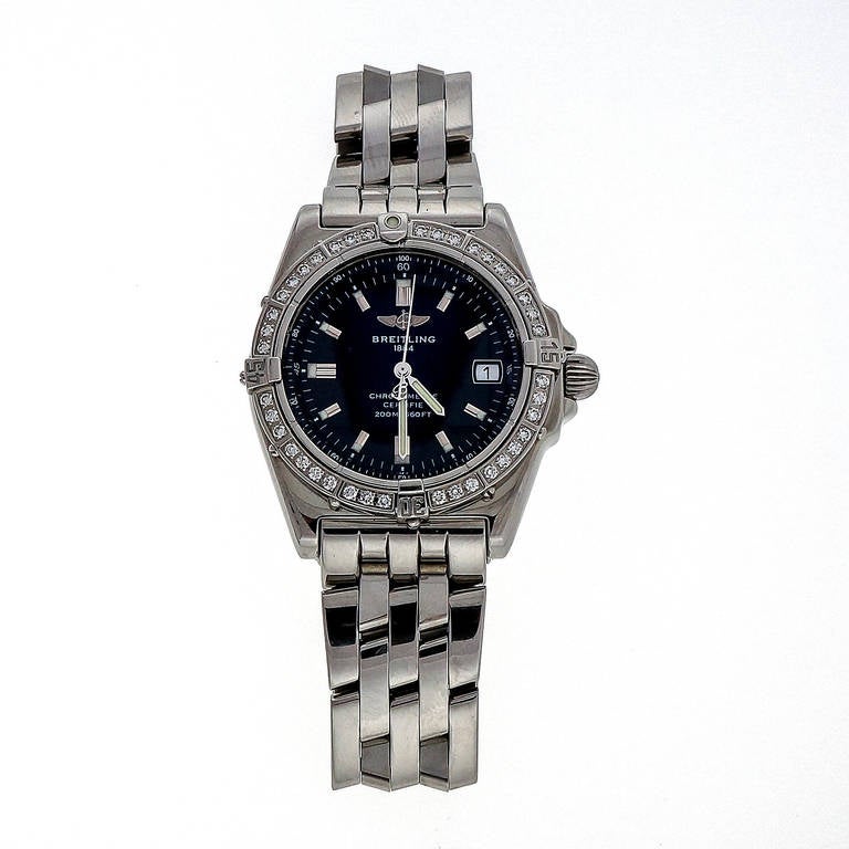 Breitling stainless steel and diamond mid-size wristwatch, circa 2000s, Ref. 1884 A77376, quartz movement. Stainless steel pilot bracelet, factory diamond bezel. 

Stainless steel
Bracelet length: 6.75 inches
Top to bottom: 39.97mm
Width