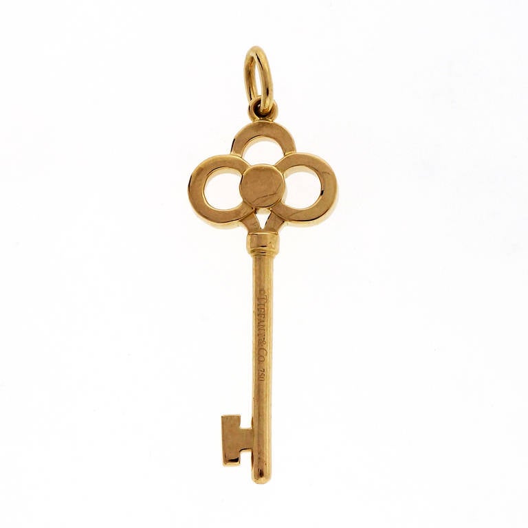 Tiffany & Co 18k Yellow goldcrown key pendant. 

47 round brilliant cut diamonds, approx. total weight .13cts, F-G, VS
18k Yellow gold
 Stamped: 750 
Hallmark: Tiffany & Co
 Tested: 18k 
3.2 grams 
Top to bottom: 36.15mm or 1.42 inches
