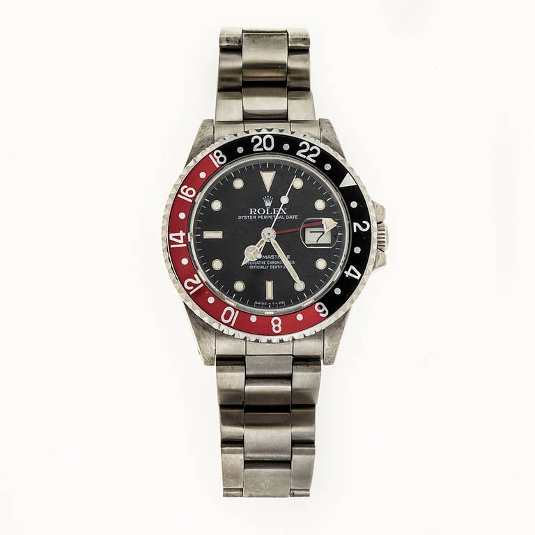 Rolex stainless steel GMT Master II wristwatch, Ref. 16760, circa 1986, with red and black bezel, original bracelet, dial and naturally faded markers

Stainless steel
Bracelet length: 8 to 8.25 inches 
Length: 47.32mm 
Width: 40mm 
Bracelet