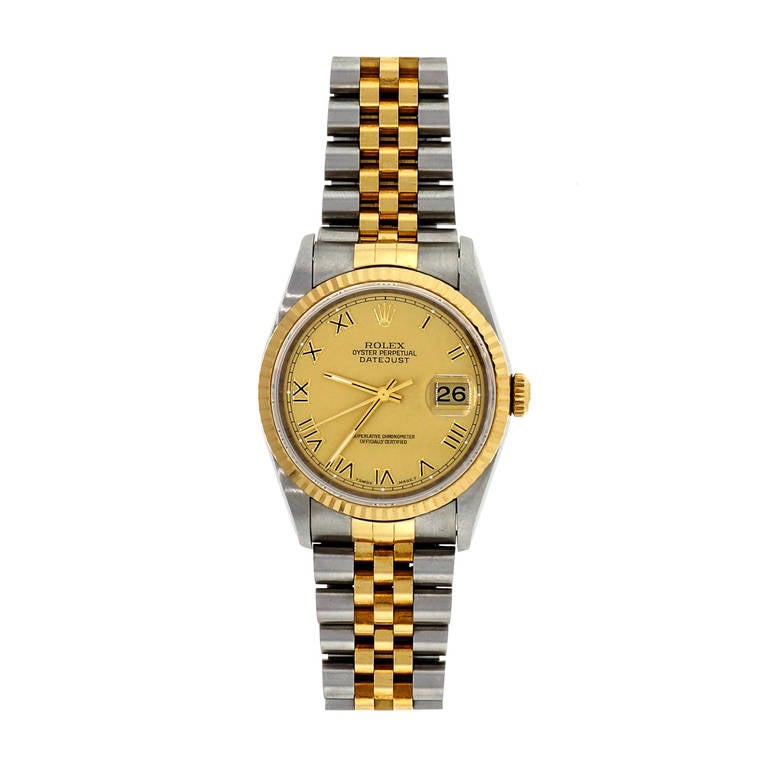 Beautiful stainless steel and yellow gold Datejust wristwatch, Ref. 16233, circa 1995. Gilt dial with Roman numerals. Original case sticker on back 16233.

Stainless steel and 18k yellow gold
Bracelet Length: 7.75 inches
Case length: