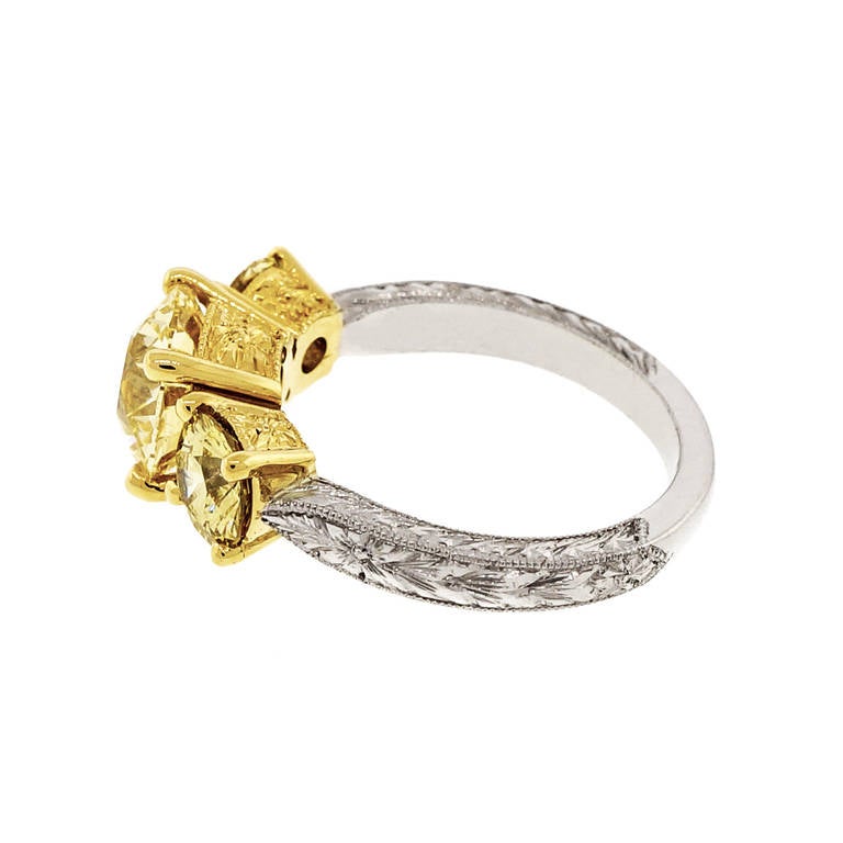 Art Deco Fancy Intense Yellow Diamond Yellow Gold Platinum Three Stone Ring