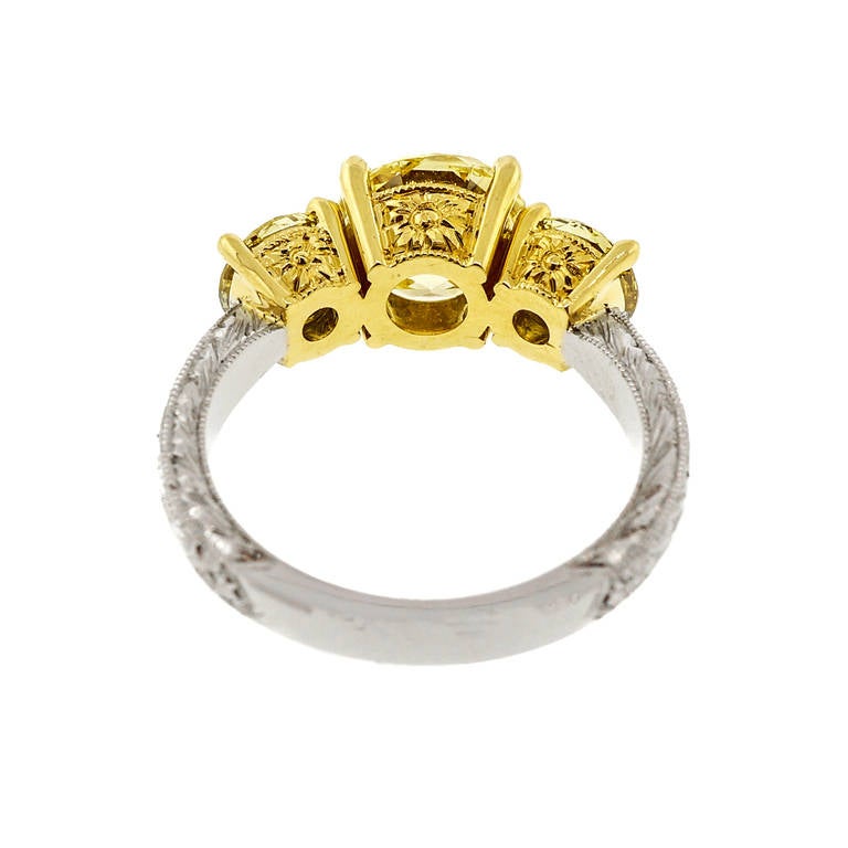 Women's Fancy Intense Yellow Diamond Yellow Gold Platinum Three Stone Ring