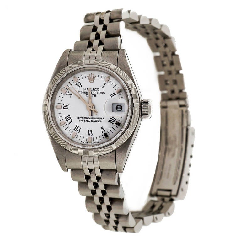 Rolex lady's stainless steel Date wristwatch, Ref. 79190, with white dial

Stainless steel
Bracelet Length: 7.5 inches
18k white gold bezel
Length: 32.7mm
Width: 26mm
Bracelet width at case: 13mm 
Case thickness: 10.6mm 
Bracelet: AB7 62510D Rolex