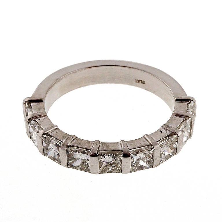 Low set extra sparkly Princess cut 9 diamond bar set band, goes a full half way plus across the finger. From the Peter Suchy Workshop.

9 Princess cut diamonds, approx. total weight 1.71cts, F, VS1 to SI1
Platinum
Stamped: Plat
Tested: