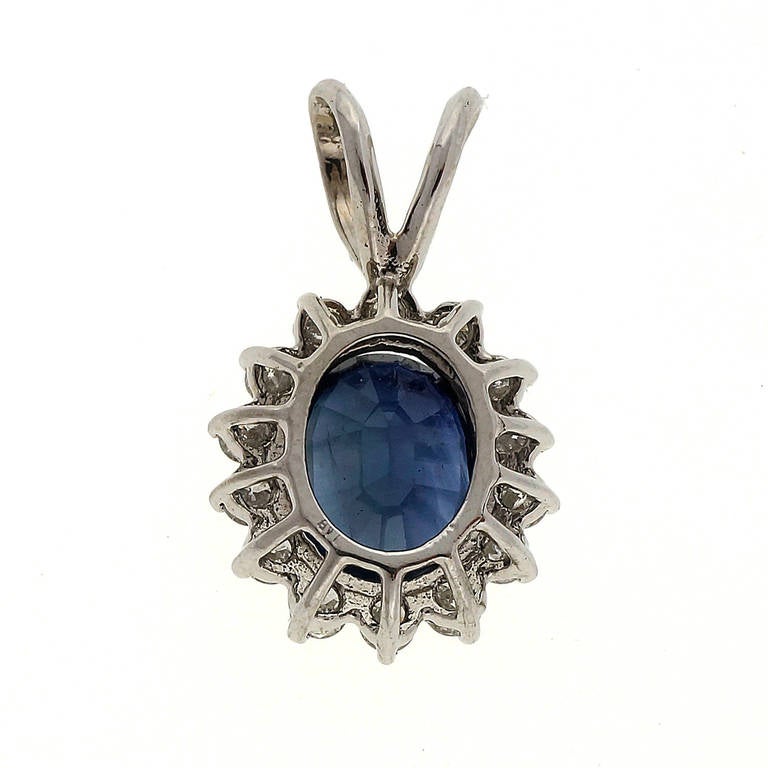 Classic delicate bright blue genuine Sapphire 2.46ct wire style pendant with contrasting white diamonds in a white gold setting.

1 oval bright blue Sapphire, approx. total weight 2.46cts, SI1, 8.5 x 7mm
14 round full cut diamonds, approx. total